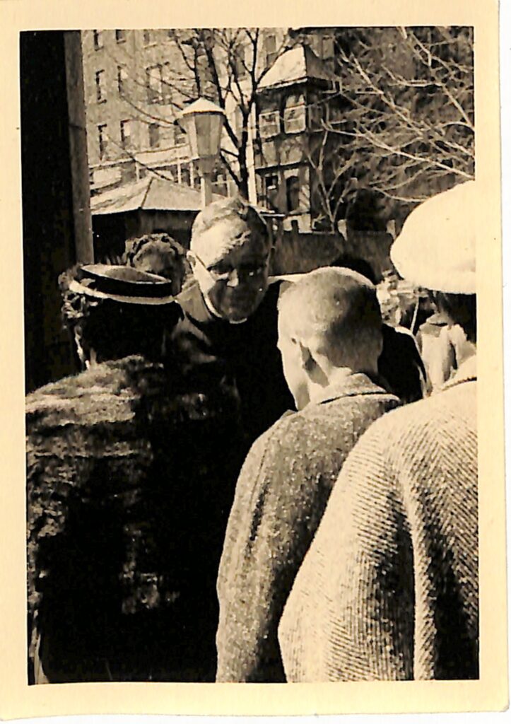 Harold Griffis greeting parishioners