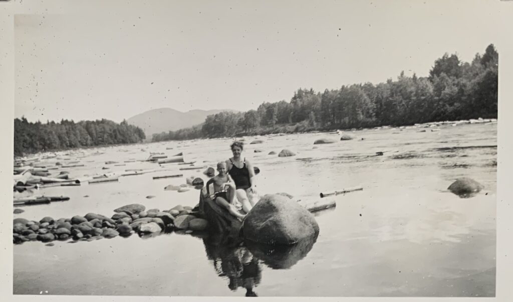 Evelyn and John on the Rock and Logs